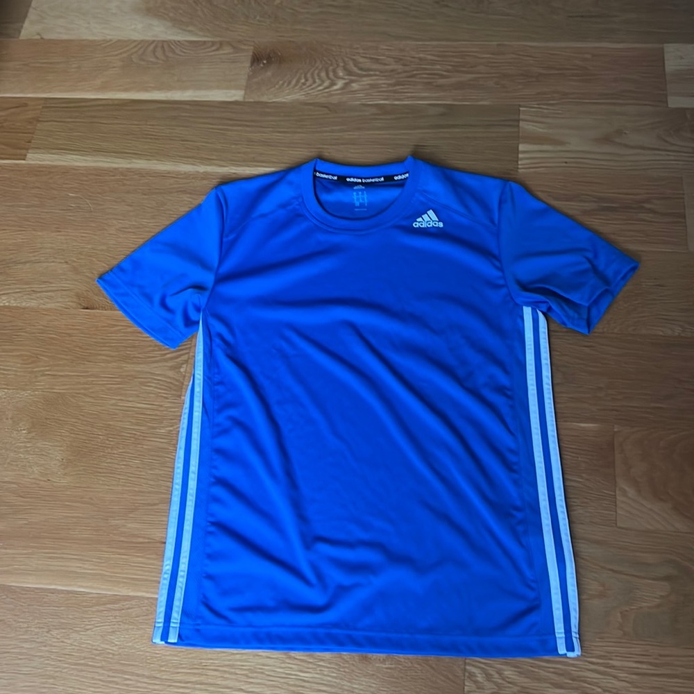 Brand new, without tags. Adidas basketball top.
